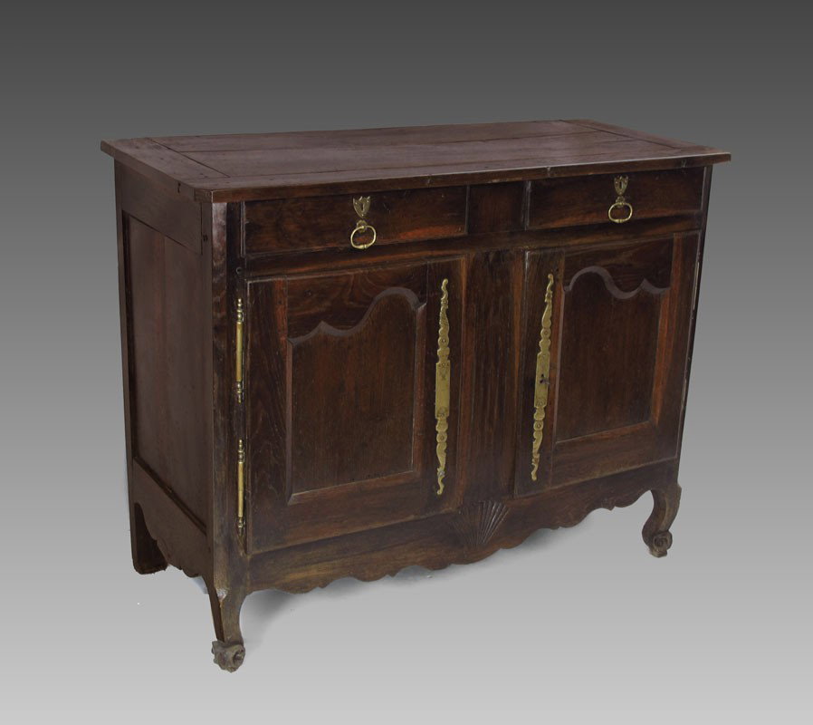 FRENCH OAK BUFFET: FRENCH OAK BUFFET: 2 drawer over 2 doors with brass hardware. Carved shell on shaped skirt, carved and shaped front legs. 38 1/2" h. x 50" x 21 1/4".
