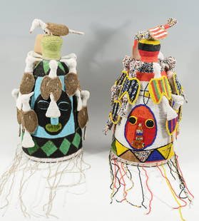 TWO YORUBA NIGERIAN AFRICAN BEADED CEREMONIAL HEADDRESSES: TWO YORUBA NIGERIAN AFRICAN BEADED CEREMONIAL HEADDRESSES: Features Faces and Birds on each with birds crowning the top, approximately 19" in height.