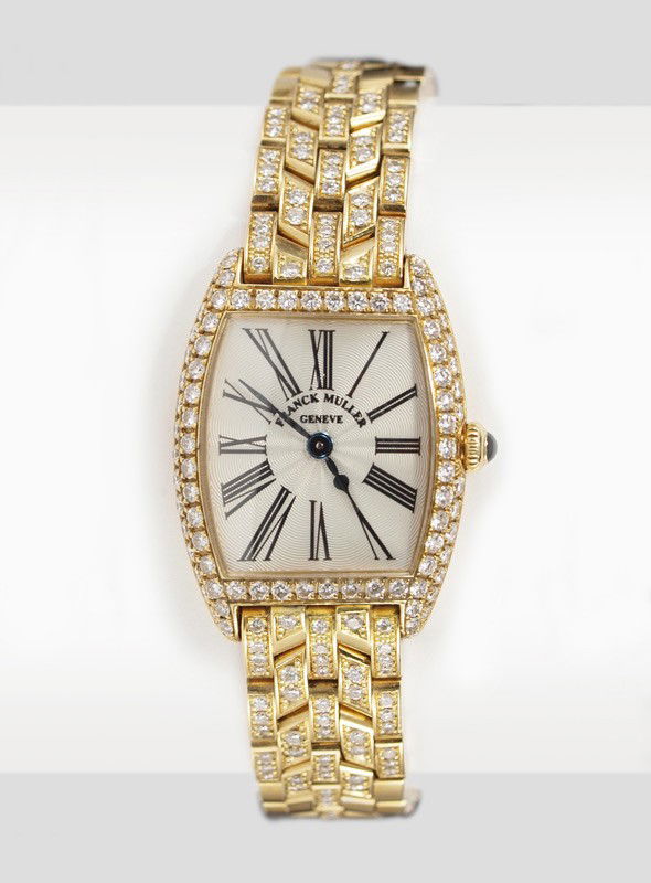 18k GOLD FRANCK MULLER CINTREE CURVEX WRISTWATCH W: LADIES FRANCK MULLER DIAMOND CINTREE CURVEX WRISTWATCH: 18k yellow gold watch and bracelet band with diamond bezel. Sapphire crystal, silver dial with Roman numerals. Quartz movement in working order.