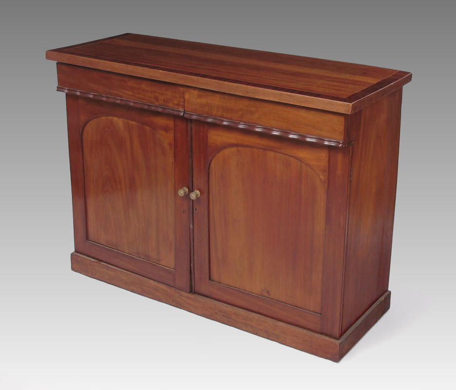 MAHOGANY GEORGIAN SIDEBOARD: MAHOGANY GEORGIAN SIDEBOARD: Mahogany top with string inlay and cross banded mahogany border. 2 half drawers with scalloped lower trim over 2 doors with 2 internal shelves. 35 1/2'' h. x 48'' x 18 1/4