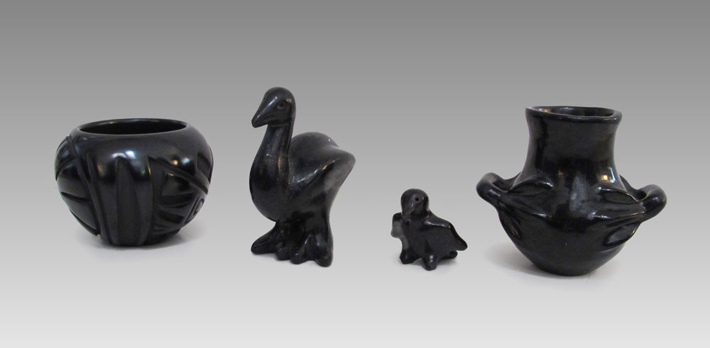4 PIECE SANTA CLARA BLACK POTTERY: 4 PIECE SANTA CLARA BLACK POTTERY: To include 1) Julia Martinez carved bowl with sun and bird motif, signed, 3 1/2'' h. x 4 3/4''. 2) Unsigned handled pot, 4 1/2'' h. x 5''. 3) Unsigned bird effigy, 4