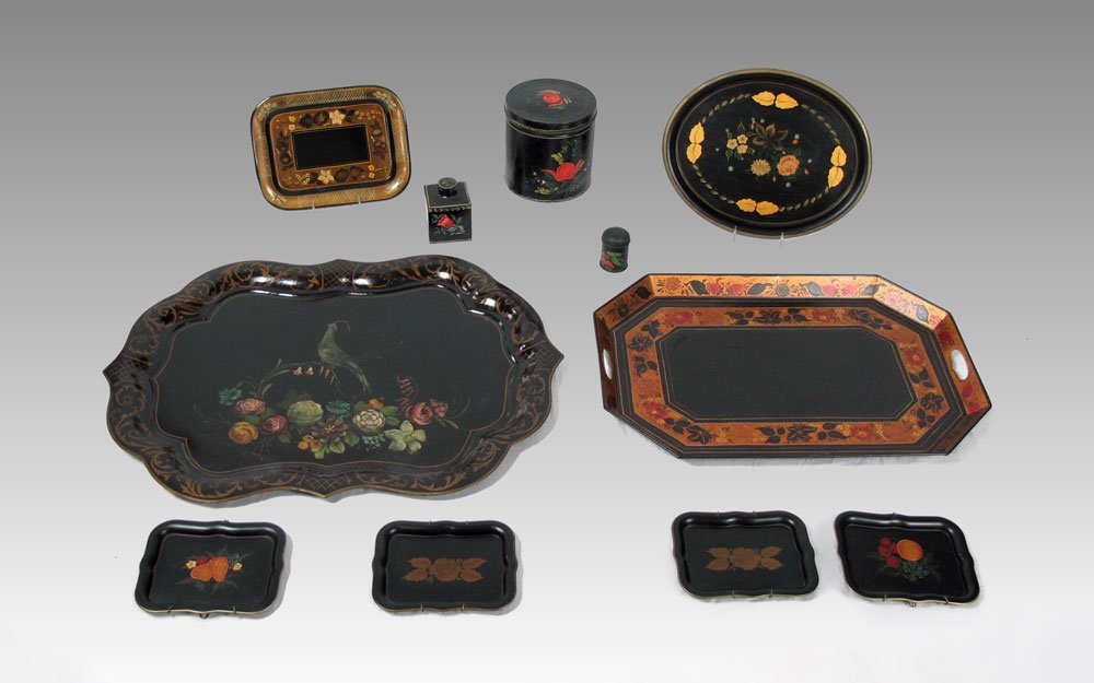 11 PIECE TOLE WARE COLLECTION: 11 PIECE TOLE WARE COLLECTION: To include 8 trays and 3 canisters with assorted decoration to include birds, fruit, flowers and geometric designs. Largest tray measures 31 1/4" x 23 1/4", largest cani