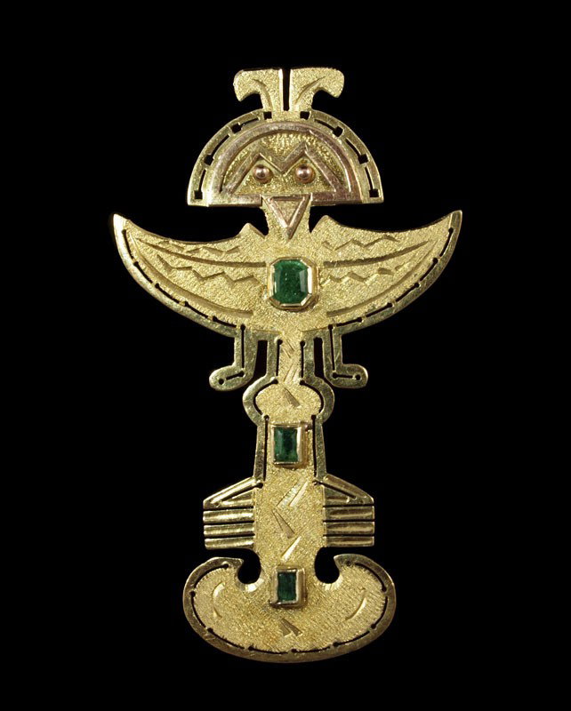 10.8 gram 18K GOLD AZTEC EMERALD FIGURAL PIN: 18K EMERALD AZTEC BROOCH/PENDANT: 18K yellow gold Aztec style brooch/pendant contains three emerald cut emeralds. Weight: .50 Ct. Approx. The emeralds are bezel set. Bar pin closure and fixed bail. Le