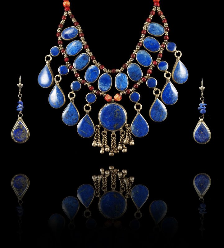 STERLING SODALITE & CORAL NECKLACE & EARRINGS: A MOST DRAMATIC SODALITE AND CORAL NECKLACE AND EARRINGS: Hand crafted sterling necklace with oval, round, and tear shaped cabochon sodalite with coral beads. Length 20". Overall weight 104 grams.