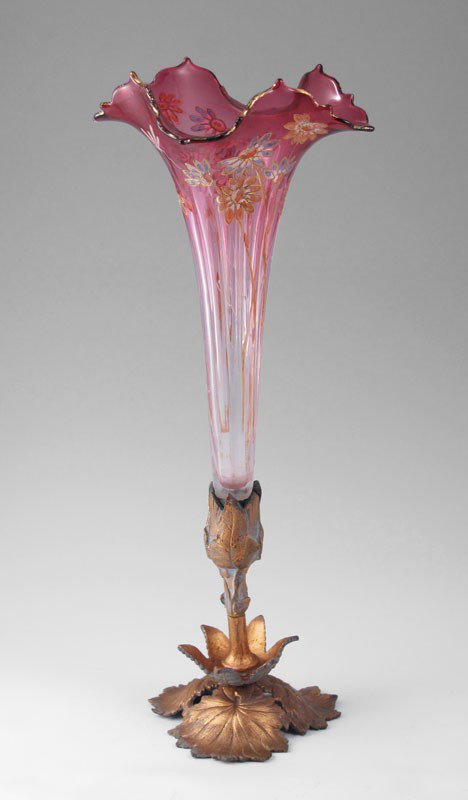 CRANBERRY GLASS VASE 16' tall: VICTORIAN ERA CRANBERRY GLASS TRUMPET VASE: Hand enameled, gilt metal mounted base. 16" tall x 6 1/2" at the widest.