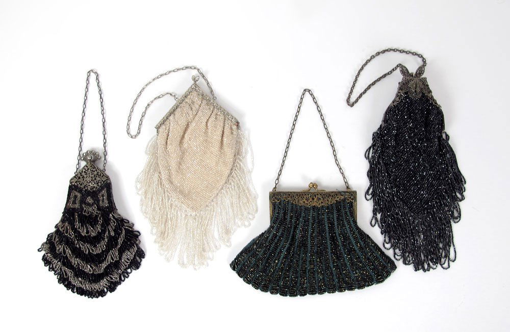 4 VINTAGE BEADED PURSES BAGS: 4 VINTAGE BEADED PURSES: Turn of the century shimmering glass beaded purses. Ornate metal frames. The largest measures approx. 11" x 4" includes the fringe.