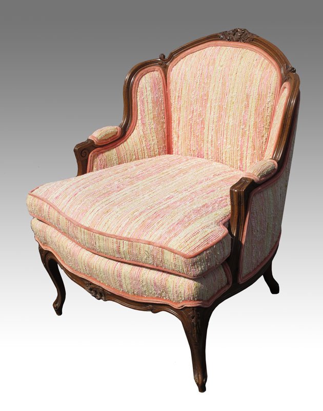 CARVED WALNUT FRENCH BERGERE CHAIR: CARVED WALNUT FRENCH BERGERE CHAIR: Generous proportion, 33"h. x 30" x 29".