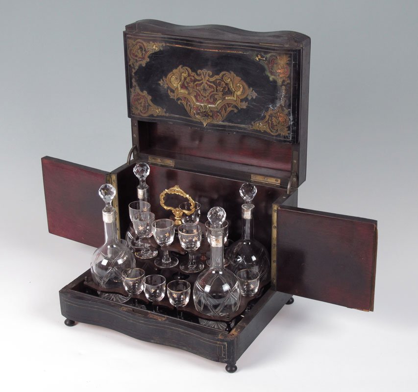 BOULLE AND TORTOISE SHELL INLAID MAHOGANY TANTALUS: BOULLE AND TORTOISE SHELL INLAID MAHOGANY TANTALUS: Inlaid Tantalus box with boulle and tortoise shell on top and front. Opens to reveal cut glass decanters and gold star decorated cordial glasses. Un