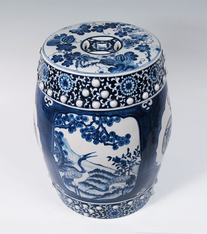 CHINESE BLUE AND WHITE DECORATED GARDEN SEAT: CHINESE BLUE AND WHITE GARDEN SEAT: Hexagonal shape with raised studs, blue and white with flowering shrubs, 18"h., 12" dia.