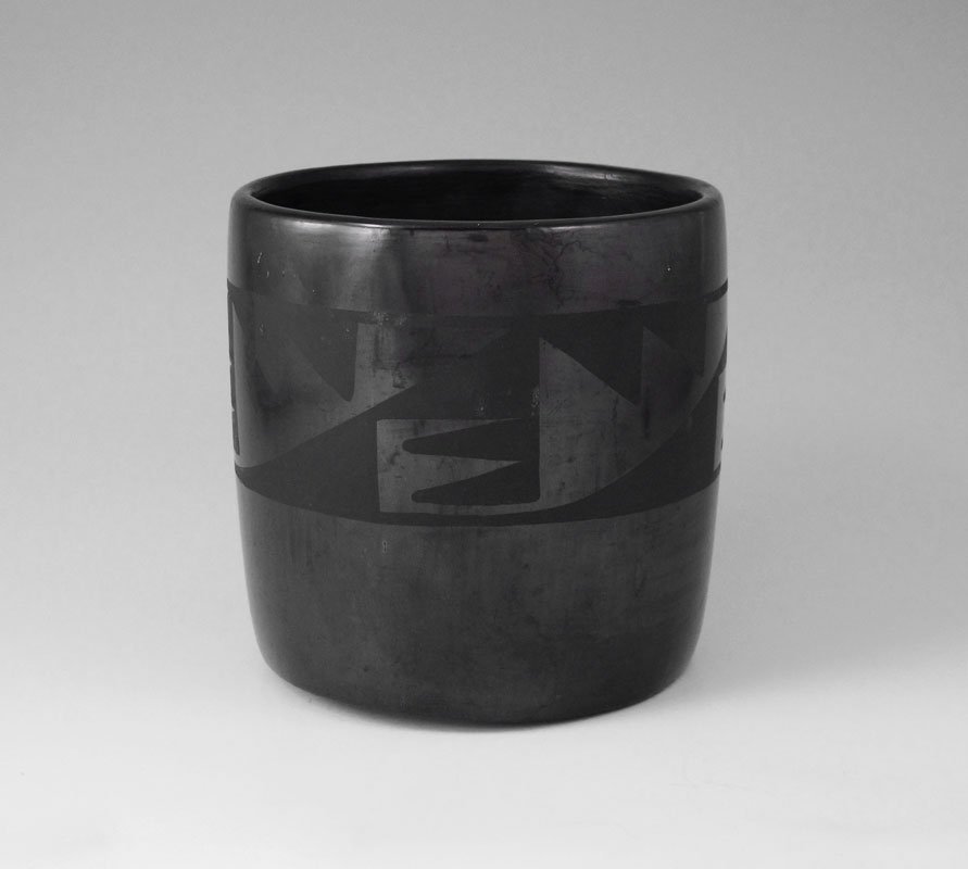 MARIE AND JULIAN MARTINEZ SANTA CLARA POTTERY POT: MARIE AND JULIAN MARTINEZ SANTA CLARA POTTERY POT: Black on black pot with painted geometric designs, incised Maria Julian signature on base. Measures 5 1/2'' h. x 5 1/2''.