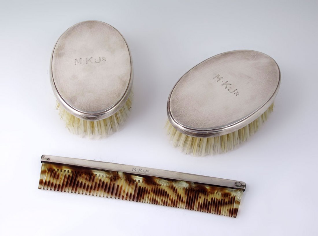 TIFFANY & CO. 3 PIECE STERLING DRESSER SET: TIFFANY & CO. 3 PIECE STERLING DRESSER SET: Marked Tiffany & Co., Makers, Sterling Silver, 31665, L. Includes 2 brushes (each 1 1/2'' h. x 5'' x 3'') and a faux tortoise shell tooth comb (7 1/4'' l.).