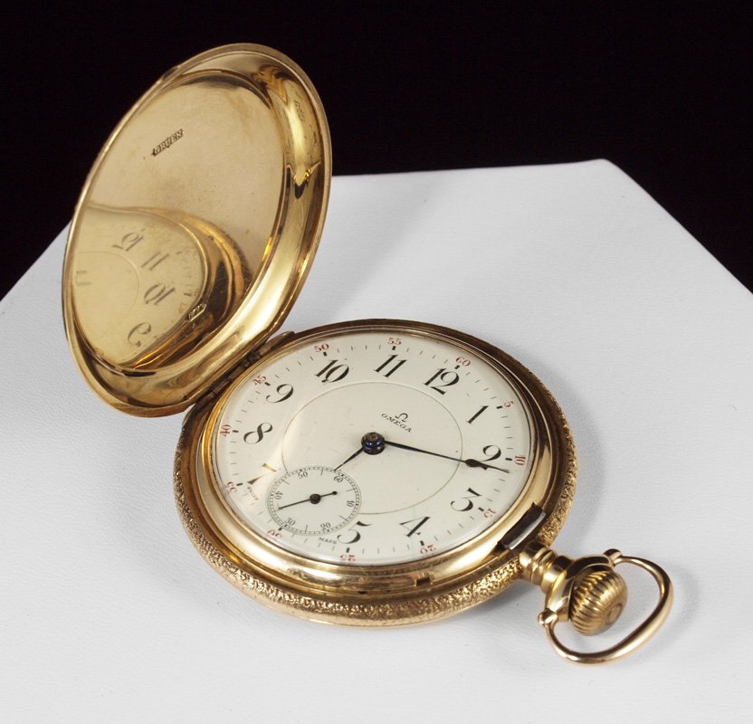 14K GOLD OMEGA POCKET WATCH CA. 1920: 14K OMEGA POCKET WATCH: Gents 14K yellow gold hunters case pocket watch. 23 jewel Swiss made movement in good running order, serial number 2615525. Original double sunk dial, spade and spear style han