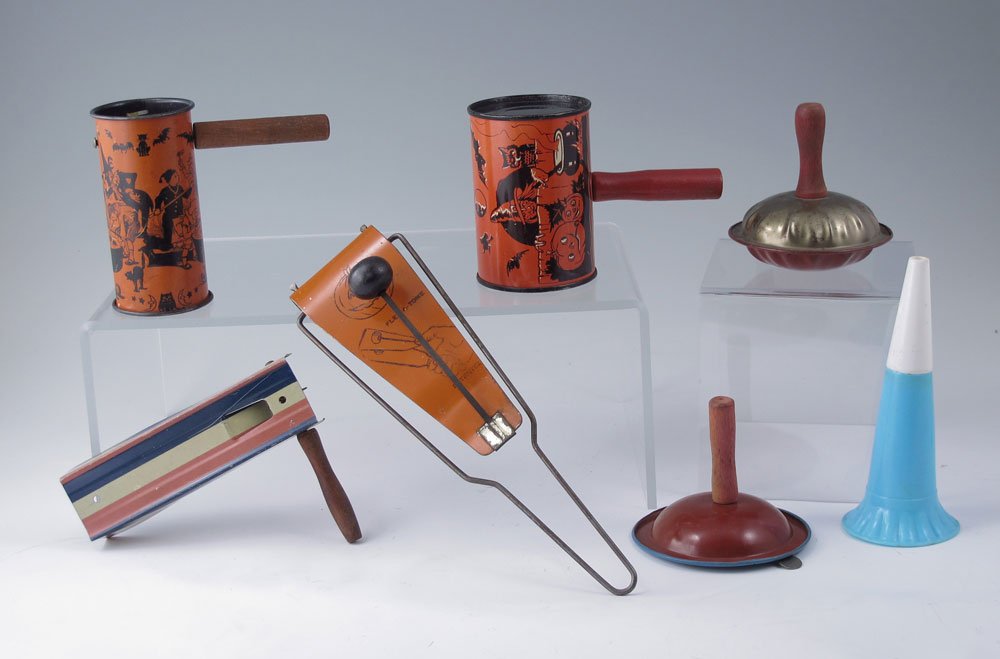 COLLECTION OF VINTAGE HALLOWEEN NOISEMAKERS: COLLECTION OF VINTAGE HALLOWEEN NOISEMAKERS: To include 3 tin litho Halloween theme, one marked US Metal Toy Mfg. Co., 4 other unmarked general use noisemakers. Largest measures 4 7/8" l. x 2 3/8" bar