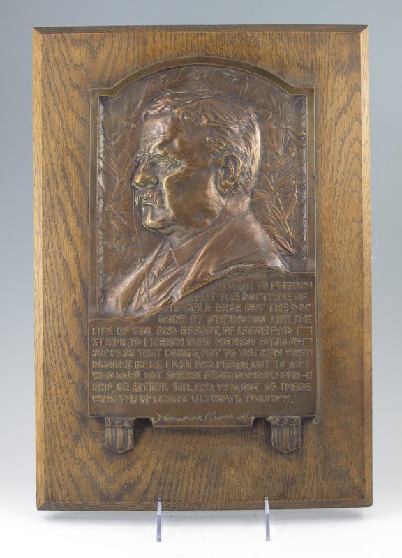 THEODORE ROOSEVELT PATINATED METAL PLAQUE: THEODORE ROOSEVELT PATINATED METAL PLAQUE: Patinated metal plaque featuring Theodore Roosevelt with quote below. Affixed to wood plank. Measures 17" x 12" x 1 1/2".