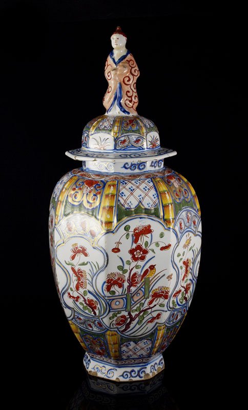EARLY DUTCH FAIENCE POLYCHROME COVERED JAR: EARLY DUTCH FAIENCE POLYCHROME COVERED JAR: Oriental motifs with figural finial top to lid. Signed on base. 14" h. x 6 1/2" dia.