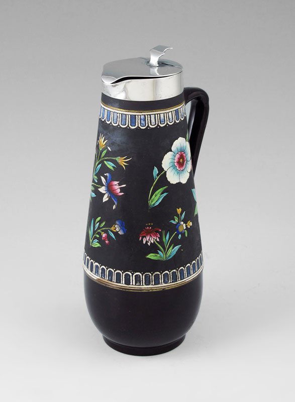 P. ASHBERRY & SONS STERLING RIM SYRUP JUG: P. ASHBERRY & SONS STERLING RIM SYRUP JUG: 1909 Sheffield hallmark hinged lid. Tin glazed floral decoration with brown glaze base. Marked simply 699 on base. Measures 8 1/2" h. x 3 3/4".