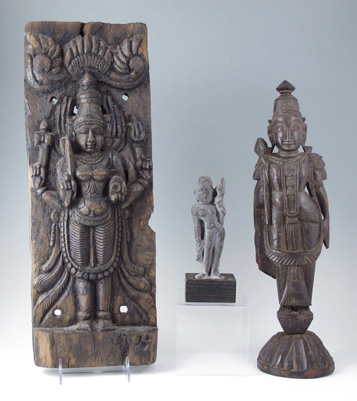 THREE HINDU CARVINGS: 3 HINDU CARVINGS: 1) Carved wood plaque, 19" x 7" x 2". 2) Carved wood Hindu goddess, 17" x 4 1/2". 3) Carved stone figure, 7 1/4"h. Age unknown.