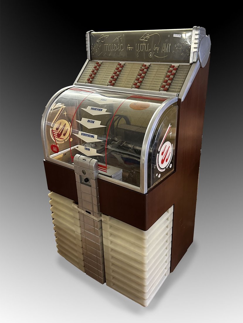 AMI MODEL D-80 COIN-OPERATED JUKEBOX: AMI MODEL D-80 COIN-OPERATED JUKEBOX: This early AMI era jukebox plays 45 RPM records, with the ability to play 80 songs in mono using 40 records. With a fully visible player mechanism. Introduced in