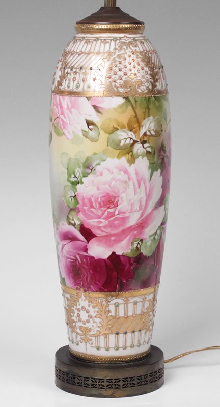 HAND PAINTED NIPPON PORCELAIN LAMP 24'' TALL: HAND PAINTED NIPPON PORCELAIN LAMP: Finely painted in a rose design with gilt and Moriage jewel type beading. Vase mounted as a lamp on reticulated metal base. The porcelain measures 17 1/2'' tall. Th