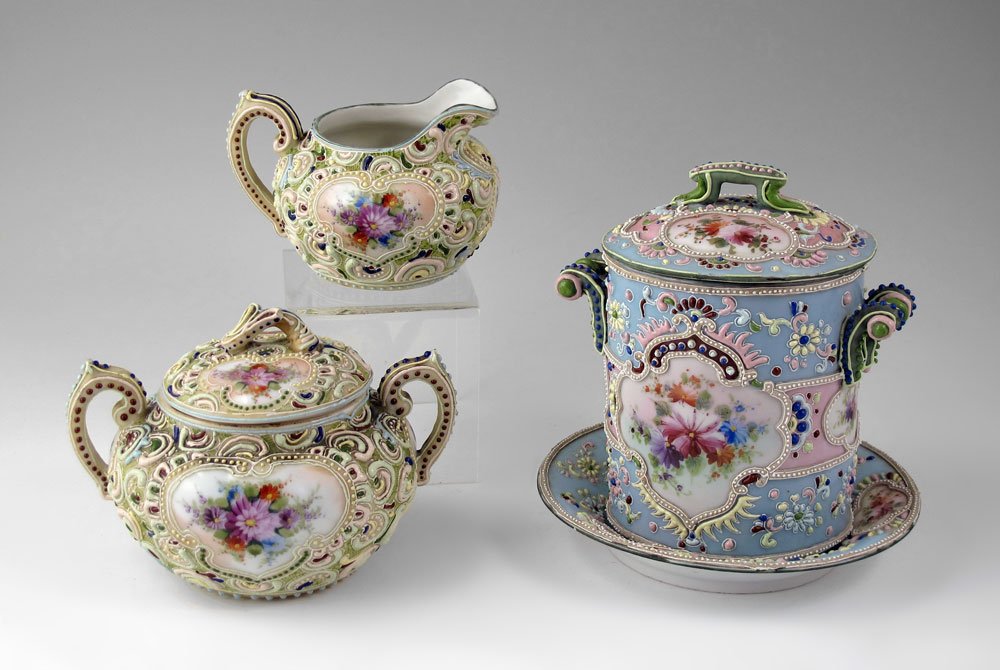 NIPPON MORIAGE CREAM PITCHER, SUGAR, CAN HOLDER: 3 PIECE NIPPON MORIAGE: A can milk holder with underplate and cover, sold with a cream pitcher and sugar. Hand painted reserves with flowers, multi color moriage decoration.