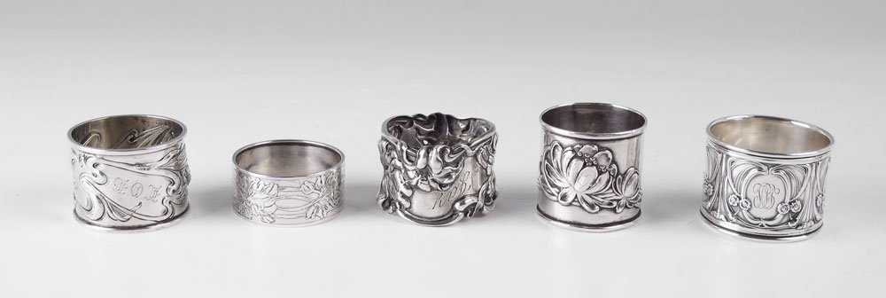 5 PC COLLECTION ART NOUVEAU STERLING NAPKIN RINGS: 5 PIECE COLLECTION ART NOUVEAU STERLING NAPKIN RINGS: An assembled collection to include Gorham, Kerr, Whiting, LaPierre, and one illegibly stamped. All monogrammed. Approx. 4.8 troy oz.