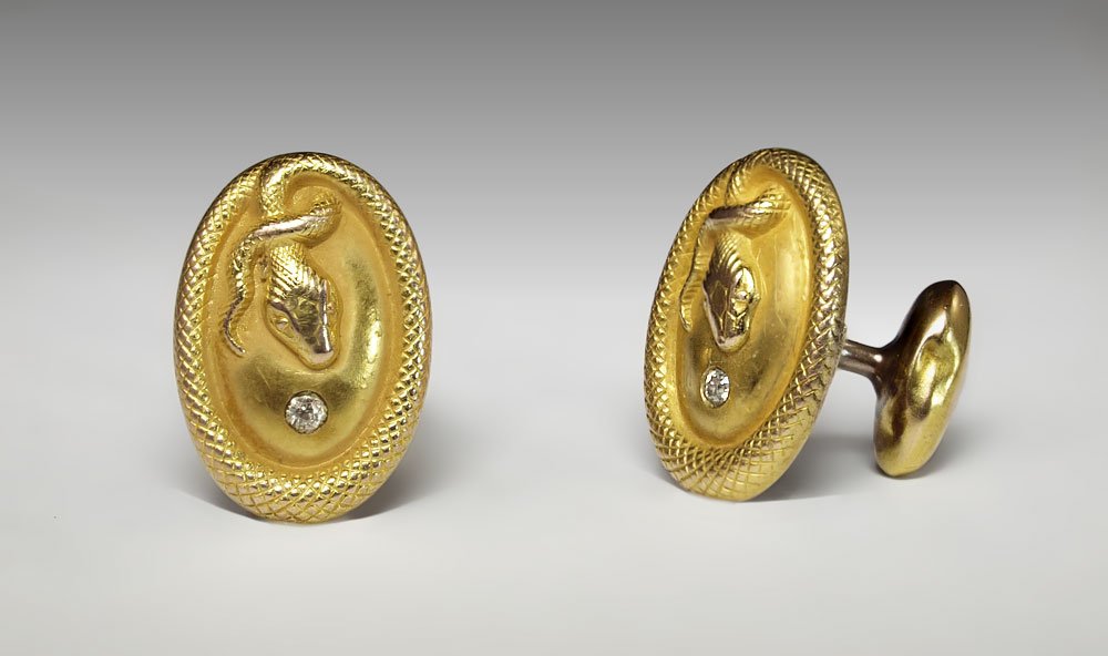 ANTIQUE 14k GOLD SNAKE CUFFLINKS 6.7 GRAMS: 14K ART DECO SNAKE DESIGN CUFFLINKS: 14K yellow gold cufflinks with snake motif. Two old European round cut diamonds. Weight: .12 Ct. Approx. VS in clarity and H-I in color. The diamonds are deep set.