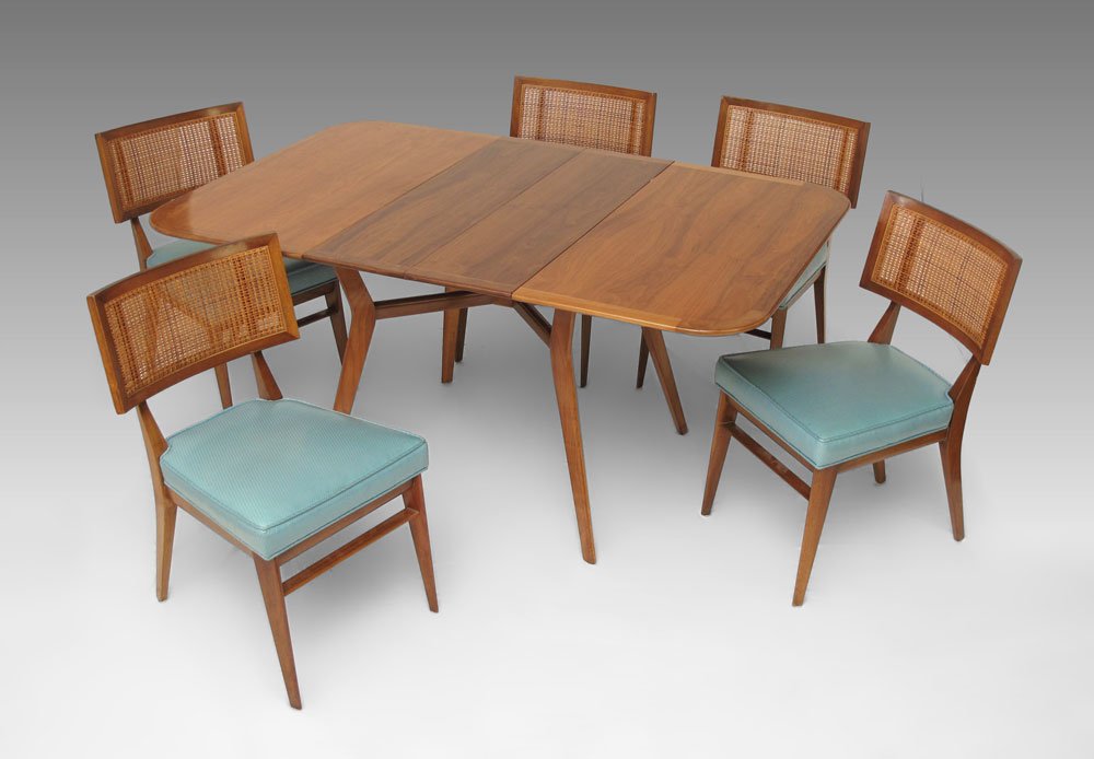 MID CENTURY DINING TABLE AND CHAIRS: MMID CENTURY DINING TABLE AND CHAIRS: Splay leg table 29 1/2" h. x 40 1/2" x 40 1/2" plus two 10 1/4" leaves. 5 cane back chairs with green vinyl upholstery, 31" h. x 19 1/2" x 20".