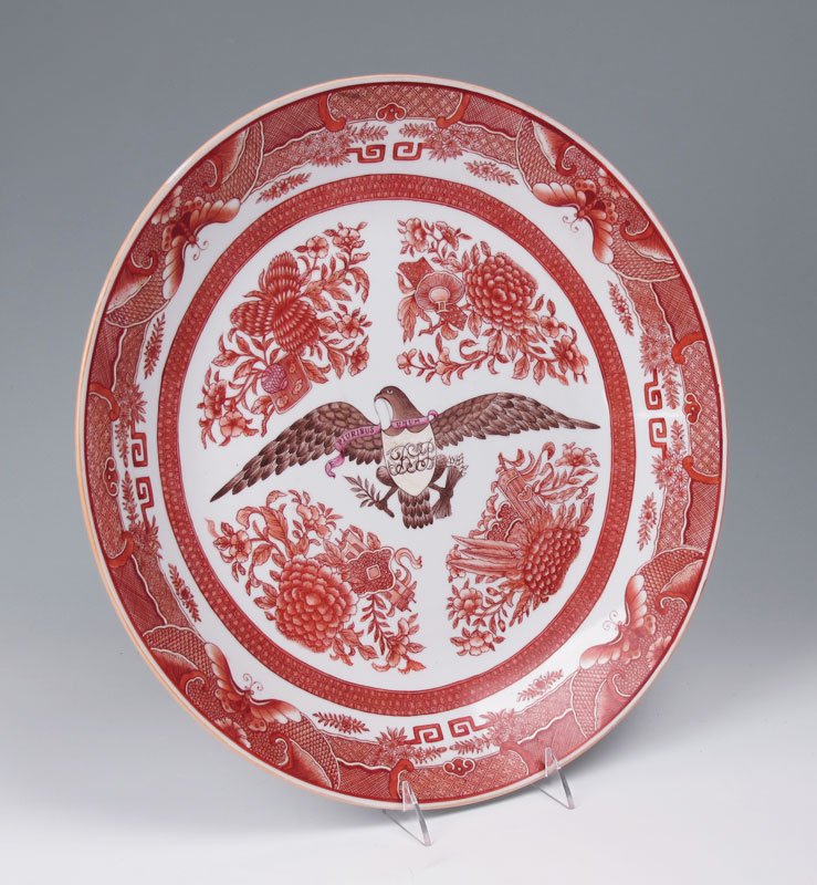 CHINESE EXPORT AMERICAN EAGLE MOTIF CHARGER: CHINESE EXPORT AMERICAN EAGLE MOTIF CHARGER: Porcelain charger with iron red oriental motifs, spread wing American eagle center with E Pluribus Unum motto banner and monogrammed on shield. Underglaze 