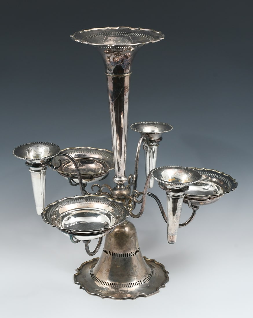 LARGE SILVERPLATE EPERGNE: LARGE SILVERPLATE EPERGNE: This silverplate epergne centerpiece holds three fluted vases and three pierced rim bowls. The flared rim and foot also pierced with scalloped edges. Approx. 19.25'' h x 16'