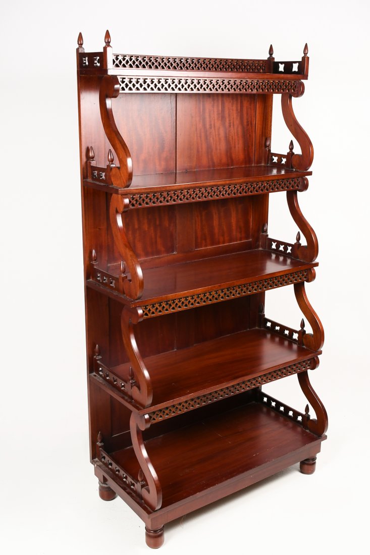 CARVED MAHOGANY 5-TIER ETAGERE: CARVED MAHOGANY 5-TIER ETAGERE: A solid mahogany 5-tier graduating open front bookshelf etagere. Each tier having scroll supports, pierced side railings, spire finials, and intricately carved frieze a