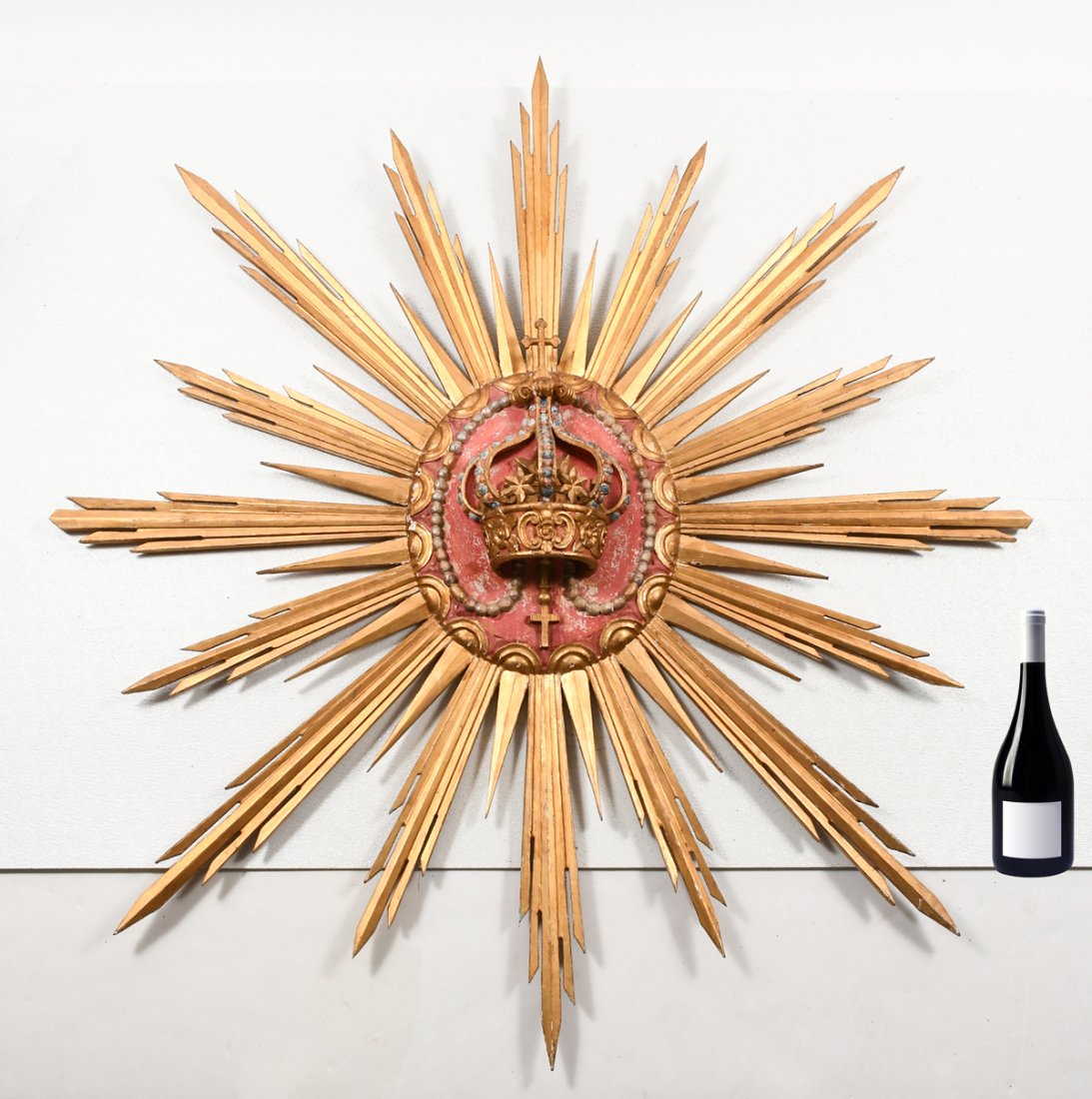 CARVED GILTWOOD PERUVIAN SUNBURST WITH CROWN: CARVED GILTWOOD PERUVIAN SUNBURST WITH CROWN: A radiant, carved giltwood & gesso Baroque sunburst sculpture having golden rays radiating from a central oval plaque with a papal style crown in high rel
