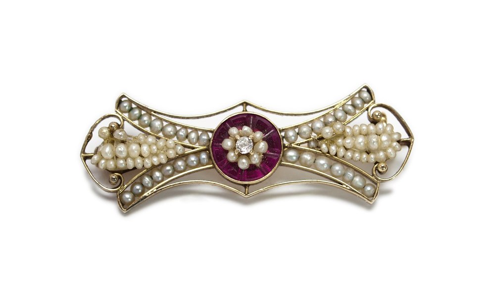ARTS & CRAFTS DIAMOND, RUBY & SEED PEARL 14k GOLD P: ARTS & CRAFTS DIAMOND, RUBY & SEED PEARL GOLD PIN: 14k yellow gold pin centers an old mine cut diamond of approx. .05 Ct., rated VS in clarity and H-I in color. The channel set, calibre cut synthetic 