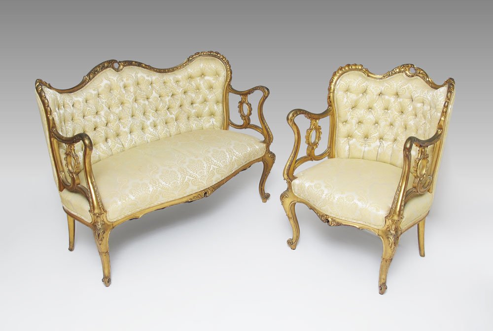LOUIS XV STYLE GOLD GILT SETTEE AND CHAIR: LOUIS XV STYLE GOLD GILT SETTEE AND GENTLEMAN'S CHAIR: 19th century, with carved and shaped top rail, arms and supports. Carved and shaped skirts and front legs. Foliate pattern tufted upholstery. Set