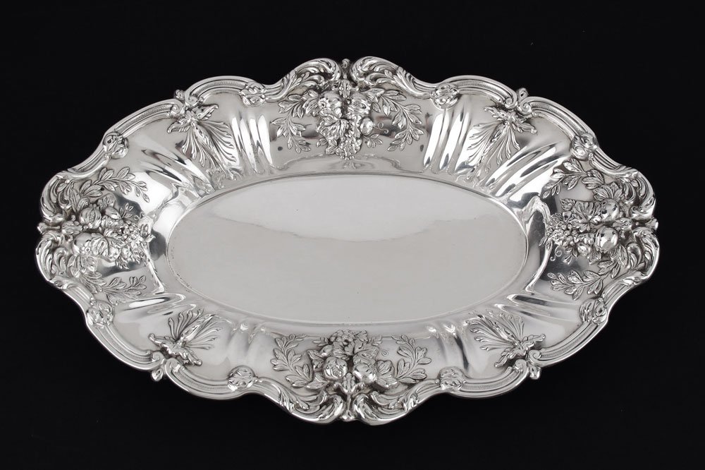REED & BARTON FRANCIS I STERLING BREAD TRAY: REED & BARTON FRANCIS I STERLING BREAD TRAY: Embossed foliate and fruit motif rim, marked on base with 1955 date mark, Reed & Barton, Sterling, X568, FRANCIS I. 1 3/4'' x 11 3/4'' x 7 1/2''. Approx. 1