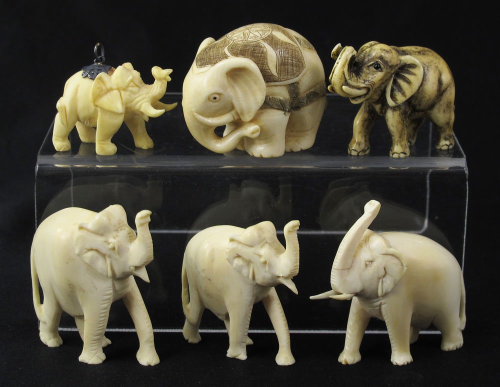 6 PIECE CARVED IVORY NETSUKE & OKIMONO: 6 PIECE CARVED IVORY NETSUKE & OKIMONO: All in the form of elephants to include 1) Mammoth ivory netsuke, signed, 1 1/4'' h. 2) Larger netsuke, signed, 1 1/2''. 3) 3 okimono, largest 2'' h. 4) Pendant