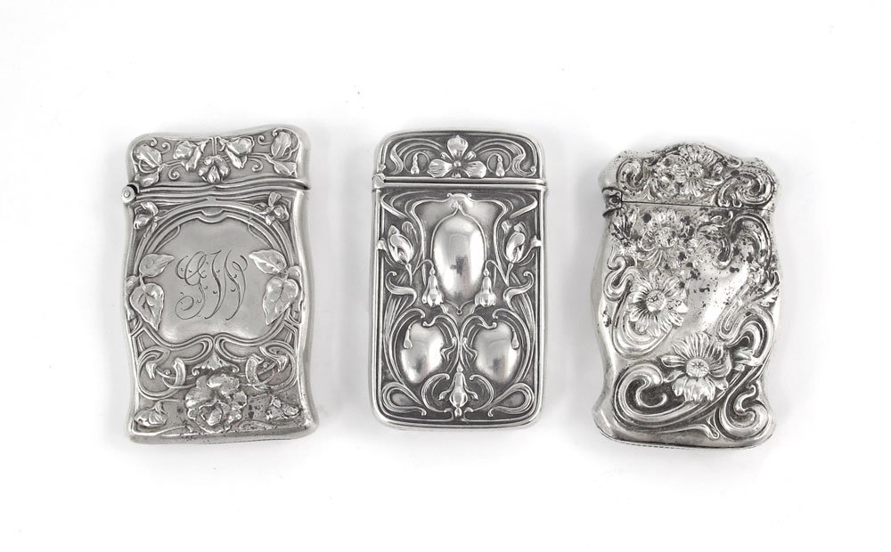 GORHAM & WATSON ART NOUVEAU STERLING MATCH SAFES: GORHAM & WATSON ART NOUVEAU STERLING MATCH SAFES: All with art nouveau era floral and foliate motifs, two by Gorham, one by Watson. 2 are monogrammed. Largest measures 2 1/2" x 1 5/8". Approx. 2.5 tro