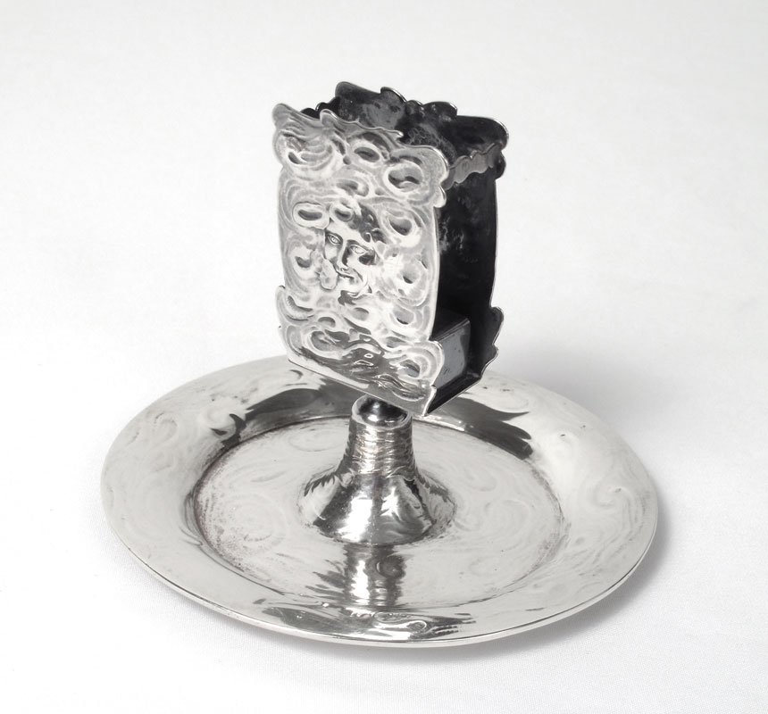 BLACK STARR FROST NOUVEAU STERLING MATCHBOX HOLDER: BLACK, STARR, & FROST ART NOUVEAU STERLING MATCH BOX HOLDER: Figural man's face enveloped in smoke, mounted to circular ashtray continuing the smoke motif. Measures 3 7/8" h. x 5" dia. Approx. 5.9 tro