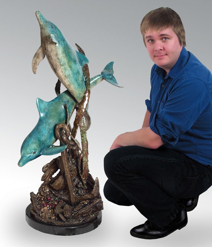 "LOST TREASURE DOLPHINS" SCULPTURE BRONZE: "LOST TREASURE DOLPHINS" SCULPTURE BY G. PIQUERA: Original bronze created by the lost wax method, mounted on a custom granite base, signed and numbered 39/299, 46" h., 17" w., 24" d., 295lbs. COA incl