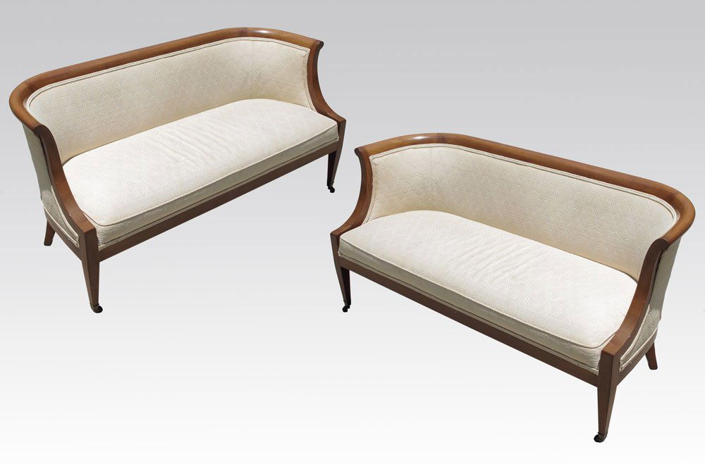 PAIR OF BIEDERMEIER STYLE SETTEES BY HERITAGE: PAIR OF BIEDERMEIER STYLE SETTEES BY HERITAGE: Shaped frame, ivory upholstery with design. Castors on front legs. Heritage label on base. 27 3/4" h. x 53 3/4" x 24 1/2".