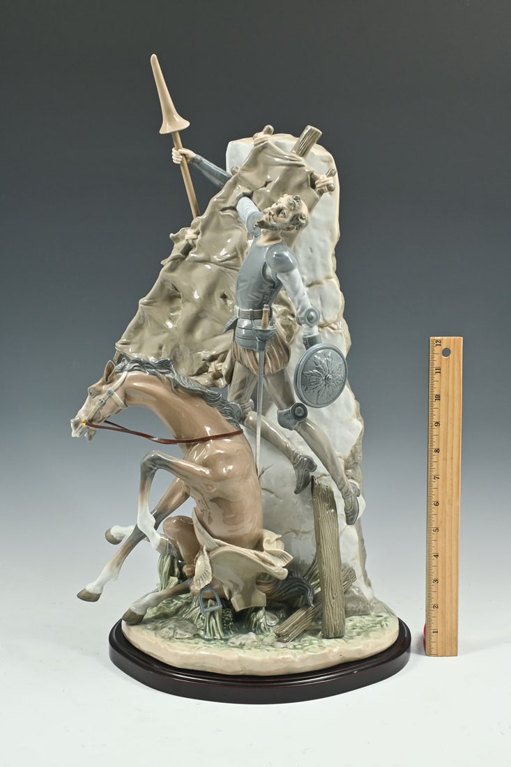 LLADRO PORCELAIN DON QUIXOTE & WINDMILL #01001497: LLADRO PORCELAIN DON QUIXOTE & WINDMILL #01001497: Lladro ''Don Quixote & the Windmill'' glossy porcelain figure depicting an animated Don Quixote & fallen horse. Retired model no. 1497, issued in 198