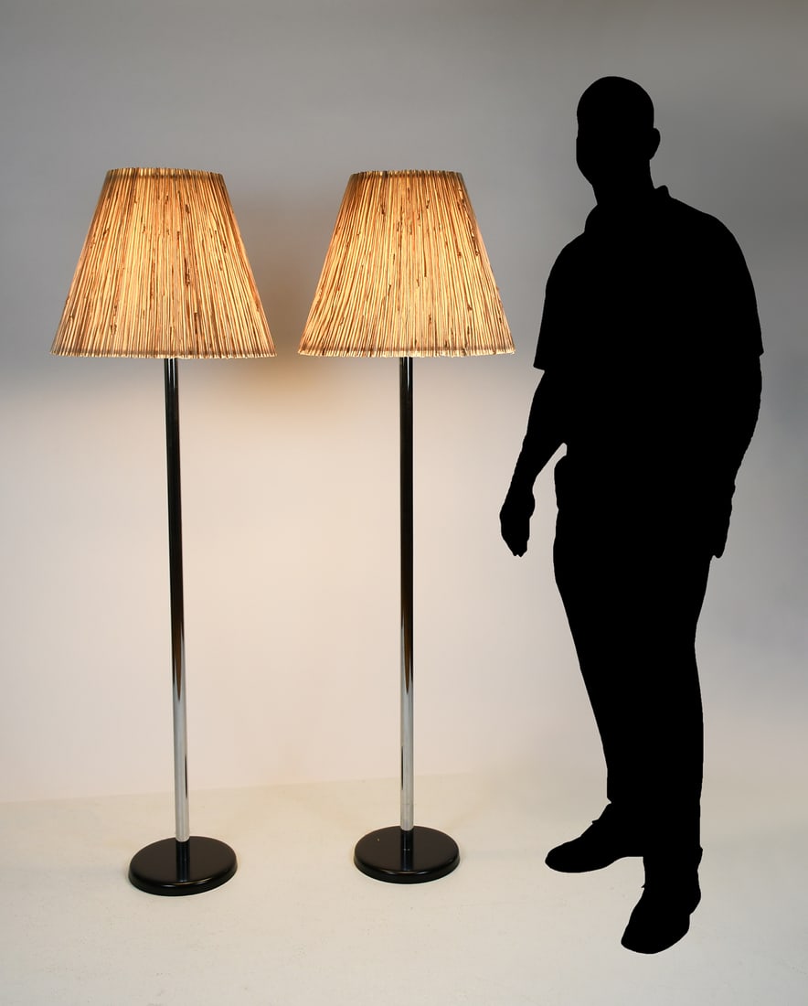 PAIR OF GOERGE KOVACS CHROMED FLOOR LAMPS: PAIR OF GOERGE KOVACS CHROMED FLOOR LAMPS: A pair of Kovacs chromed floor lamps with pleated lampshades. Each lamp having five bulb sockets and a three-way switch. With round brass finials and resting