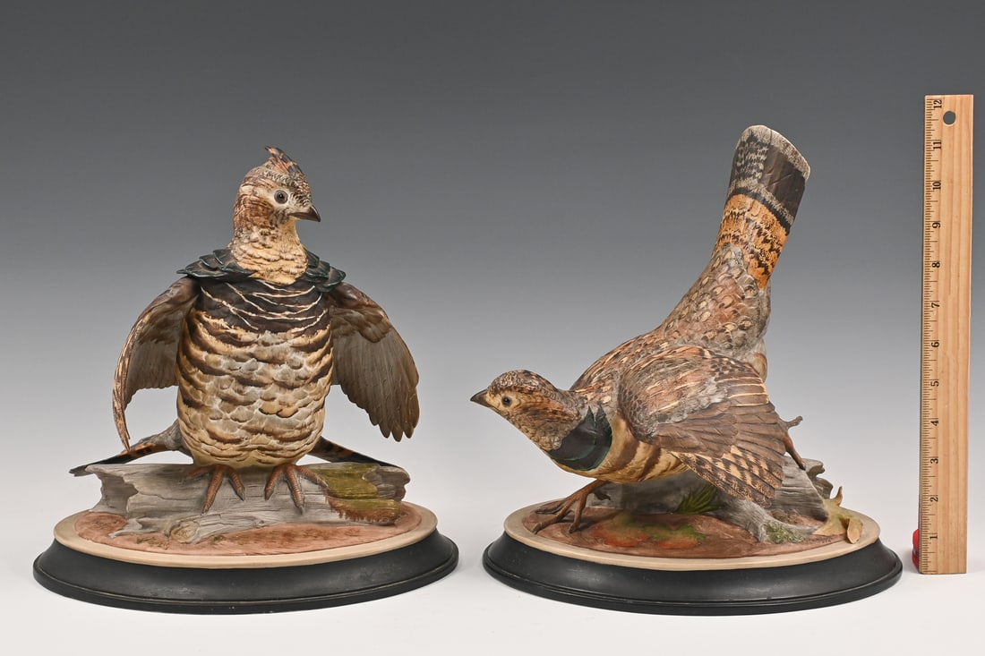 2 PC. BOEHM PORCELAIN RUFFLED GROUSE FIGURES: 2 PC. BOEHM PORCELAIN RUFFLED GROUSE FIGURES: A pair of hand-painted bisque Boehm Porcelain Ruffled Grouse figures, each on an oval base with a weathered log and displaying courtship postures. Each si