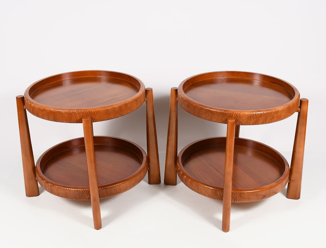 PAIR OF TOMMY BAHAMA TEAK SIDE TABLES: PAIR OF TOMMY BAHAMA TEAK SIDE TABLES: A pair of matching, solid teak two-tier, round side tables with removable tray tops and textural, carved edges. Approx. 24'' h x 23.75'' w x 23.75'' d.