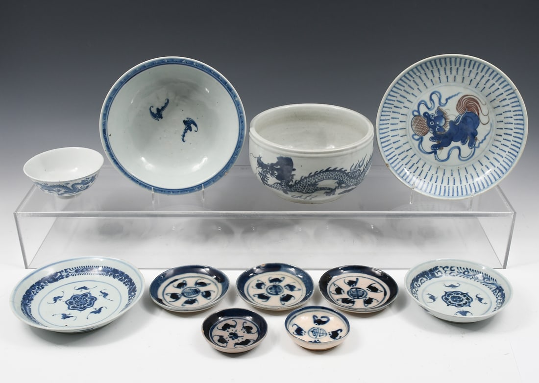 11 PC. CHINESE PORCELAIN DRAGON & BAT MOTIF BOWLS: 11 PC. CHINESE PORCELAIN DRAGON & BAT MOTIF BOWLS: Comprising; 2- Blue & white Dragon bowls, 1- Foo Dog Motif Bowl, & 8- Bat Motif Bowls & Dishes. Largest Approx. 4.5" h x 8" dia.