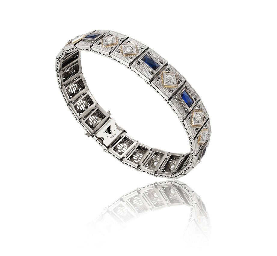 14k & PLATINUM FILIGREE 1 CT DIAMOND BRACELET: 14K WHITE GOLD & PLATINUM FILIGREE BRACELET: With 11 Old mine cut diamonds totaling approx. 1 Ct., rated VS-SI in clarity and H-I in color. There are 6 bezel set rectangular shaped French cut sapphire