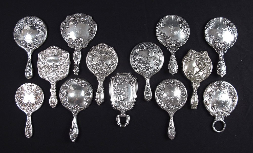 COLLECTION OF 12 ART NOUVEAU STERLING MIRRORS: COLLECTION OF 12 ART NOUVEAU STERLING MIRRORS: All with figural and floral motifs, highlighted makers to include Simons Brothers, International Silver, Foster & Bailey, Mauser and unknown or illegible