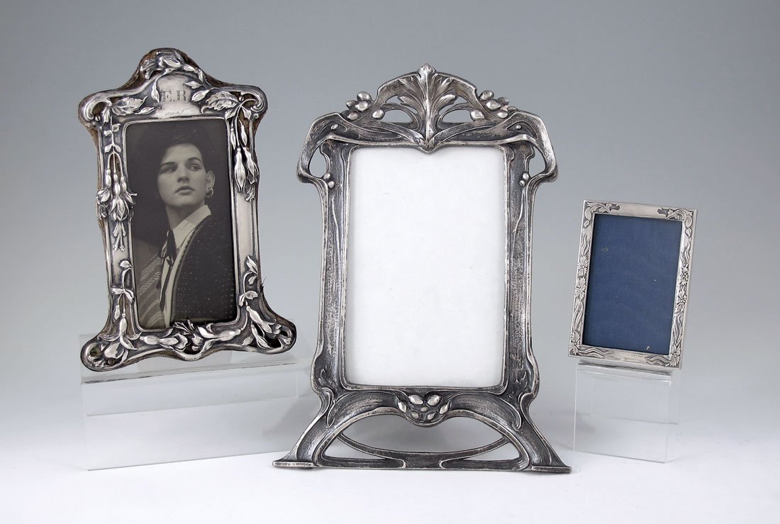 3 ART NOUVEAU STERLING PHOTO FRAMES: 3 ART NOUVEAU STERLING PHOTO FRAMES: Smallest marked with I. N. Deitsch hallmarks, medium marked Dominick & Haff and monogrammed, largest marked Mauser. All with foliate and floral motifs. Largest mea