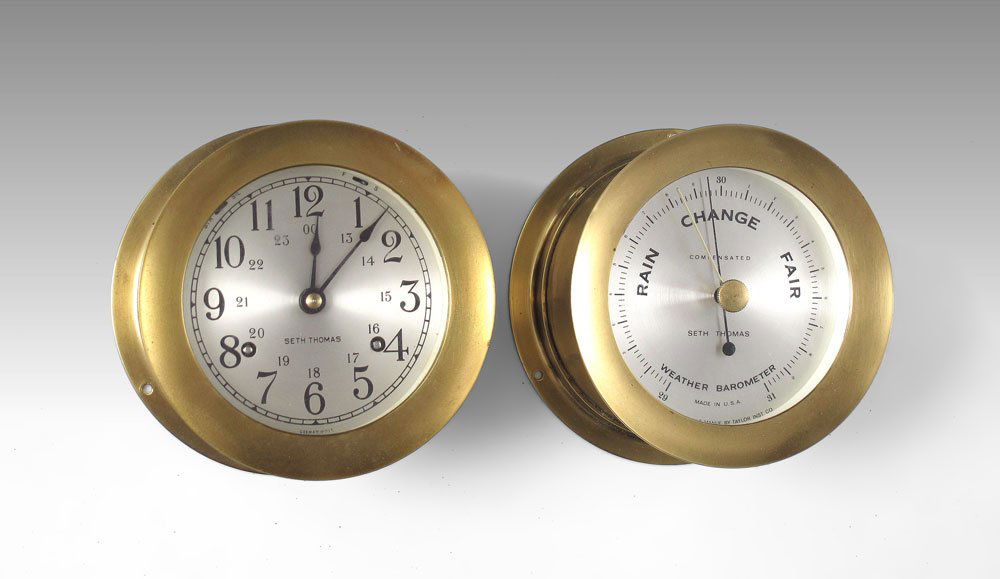 SETH THOMAS CORSAIR SHIPS BAROMETER AND CLOCK: SETH THOMAS SHIPS BAROMETER AND CLOCK: Matched pair Corsair brass case clock and barometer by Seth Thomas. Key in office. Each measures 3 1/8" x 5 3/8".