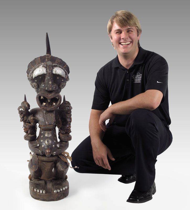 CARVED AFRICAN SONGYE FETISH POWER FIGURE: CARVED AFRICAN SONGYE FETISH POWER FIGURE WITH DOLLS: 15 LBS., 32'' x 11'' x 9''.