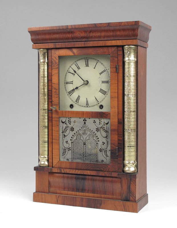 CHAUNCEY JEROME MANTLE CLOCK: CHAUNCEY JEROME MANTLE CLOCK: Walnut veneer with gold painted half columns. Painted metal dial, original Chauncey Jerome label affixed interior back panel. 8 day time and strike movement. Key and pend